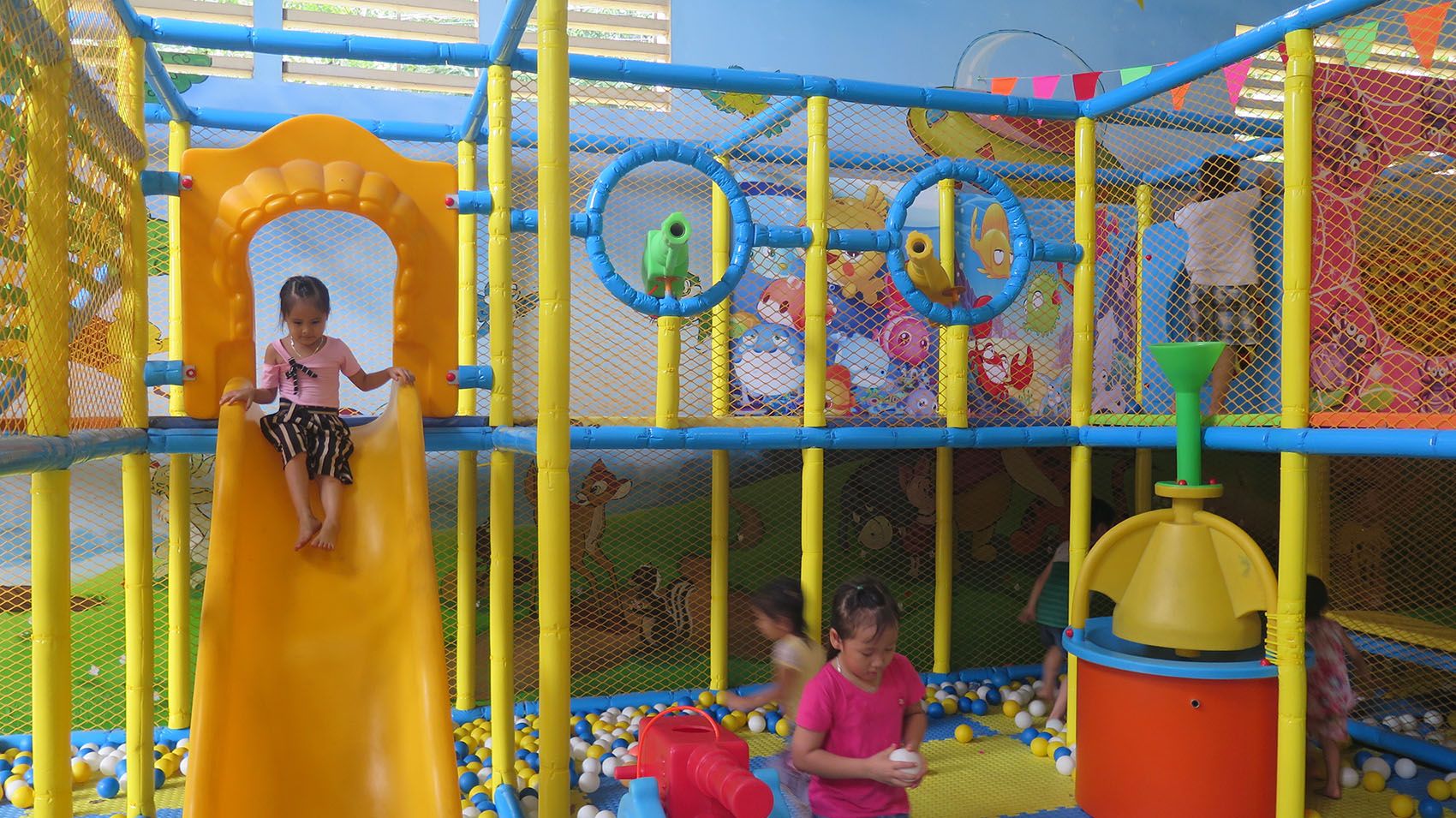 A picture containing yellow, colorful, outdoor object, playground

Description automatically generated