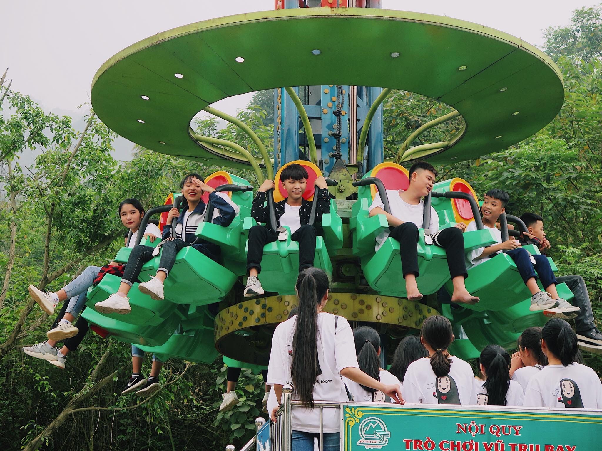 A group of people riding a roller coaster

Description automatically generated with medium confidence